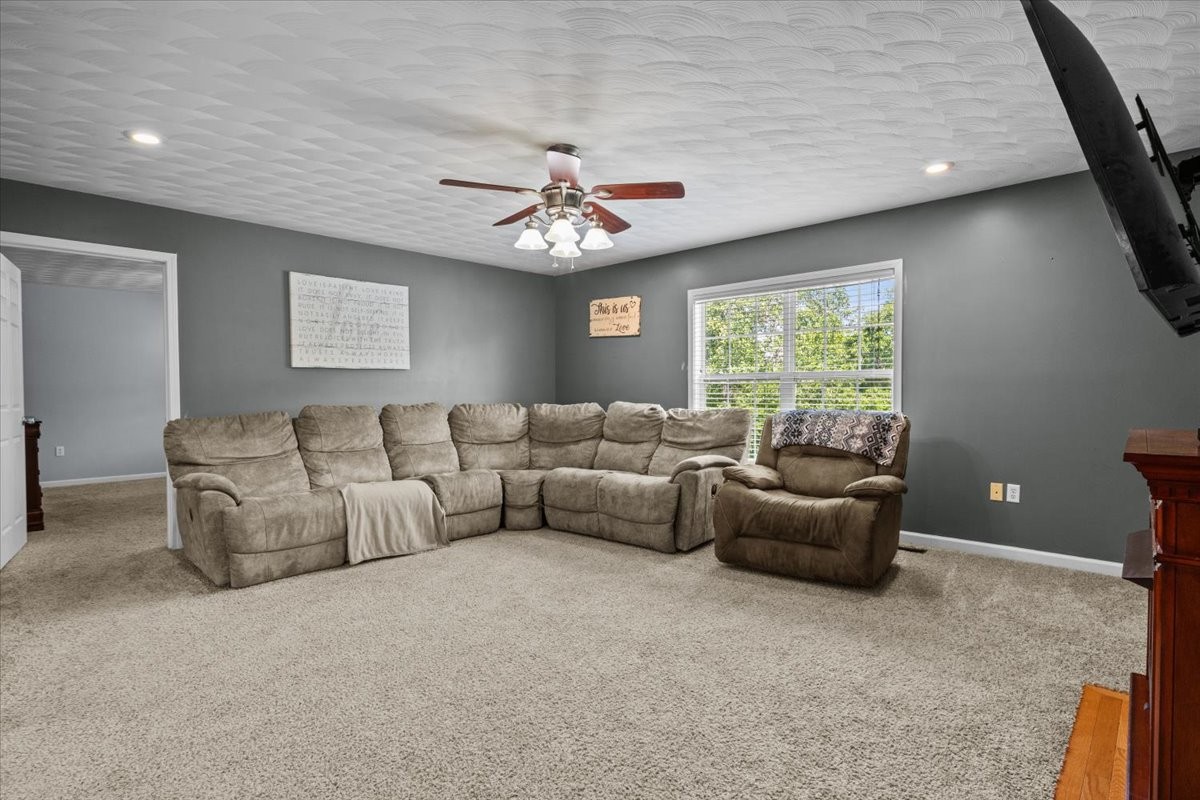 109 Bessie Clark Road Erin, TN 37061 - Photo 17 of 43 a living room with furniture and a window