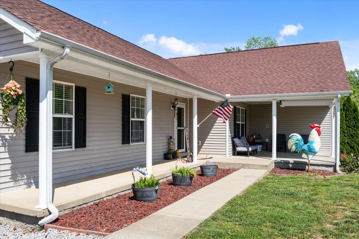 109 Bessie Clark Road Erin, TN 37061 - Photo 2 of 43 a front view of a house with patio