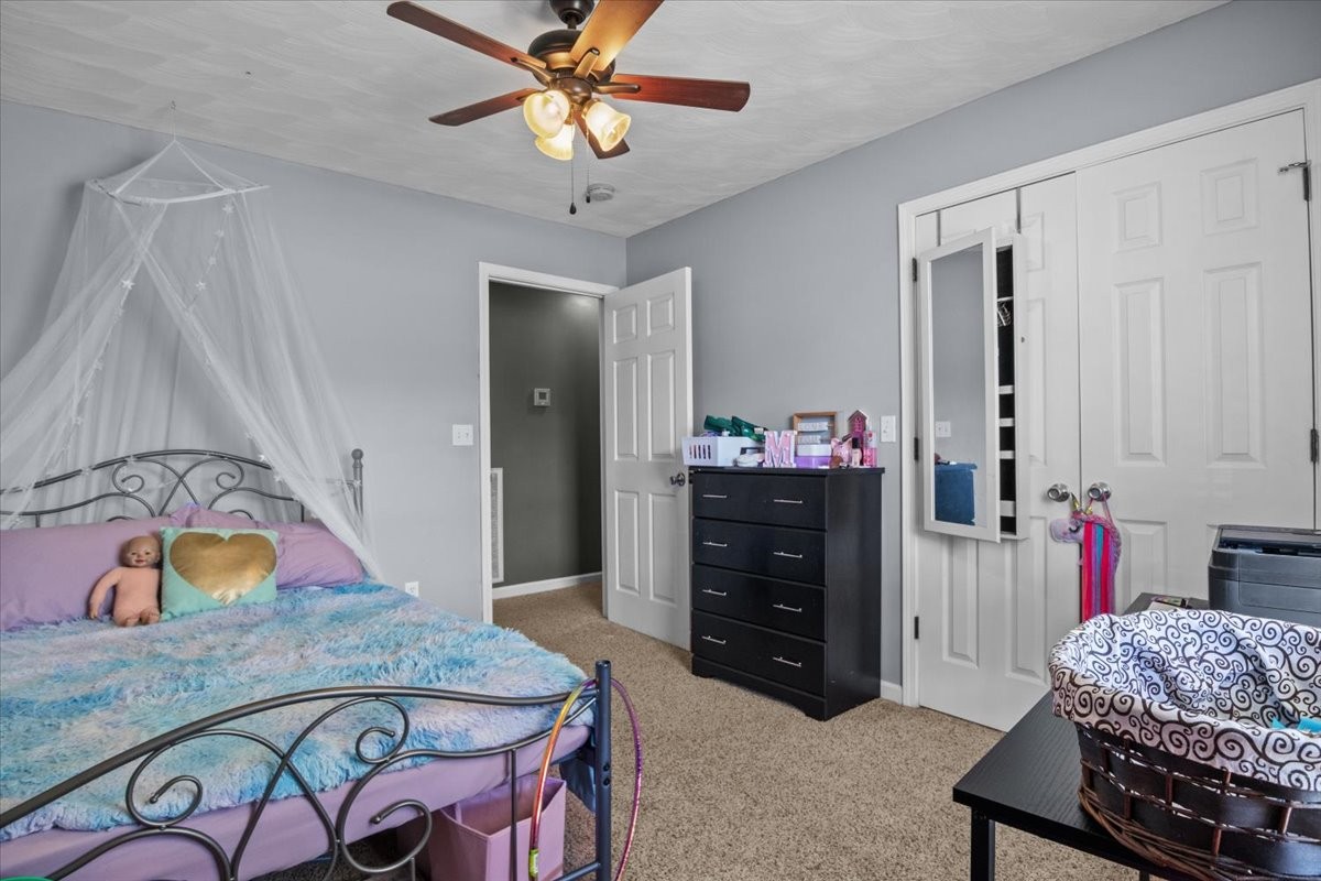 109 Bessie Clark Road Erin, TN 37061 - Photo 27 of 43 a bedroom with a bed and a dresser