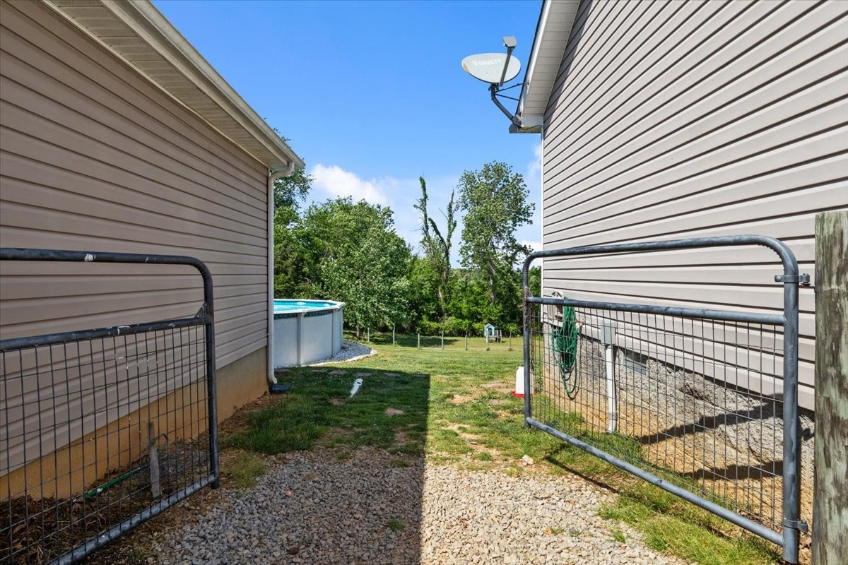 109 Bessie Clark Road Erin, TN 37061 - Photo 33 of 43 a view of a backyard with a trees
