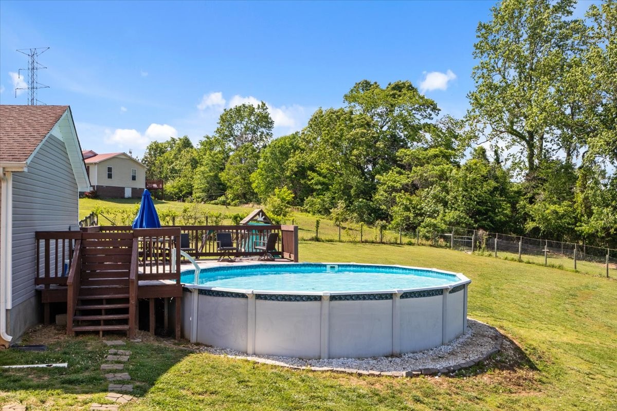 109 Bessie Clark Road Erin, TN 37061 - Photo 35 of 43 a view of a swimming pool with a patio