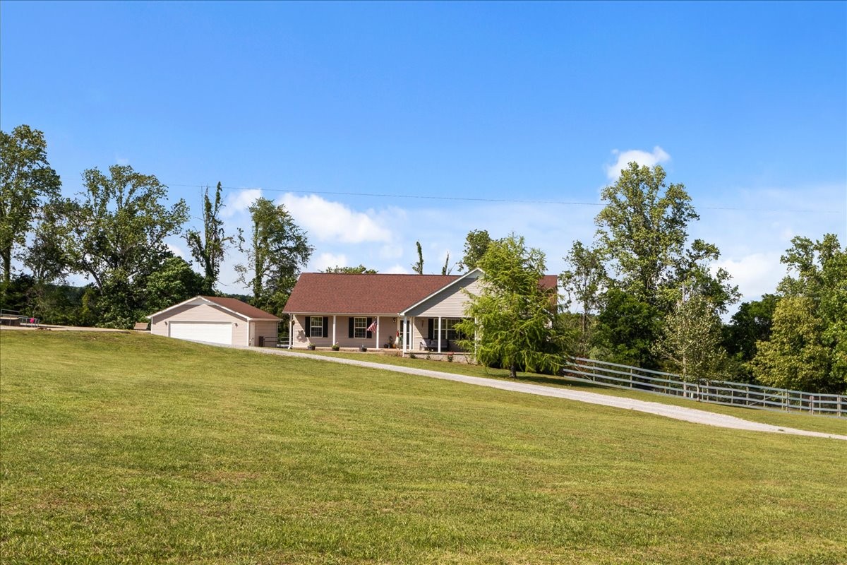 109 Bessie Clark Road Erin, TN 37061 - Photo 4 of 43 a view of a swimming pool with an ocean view