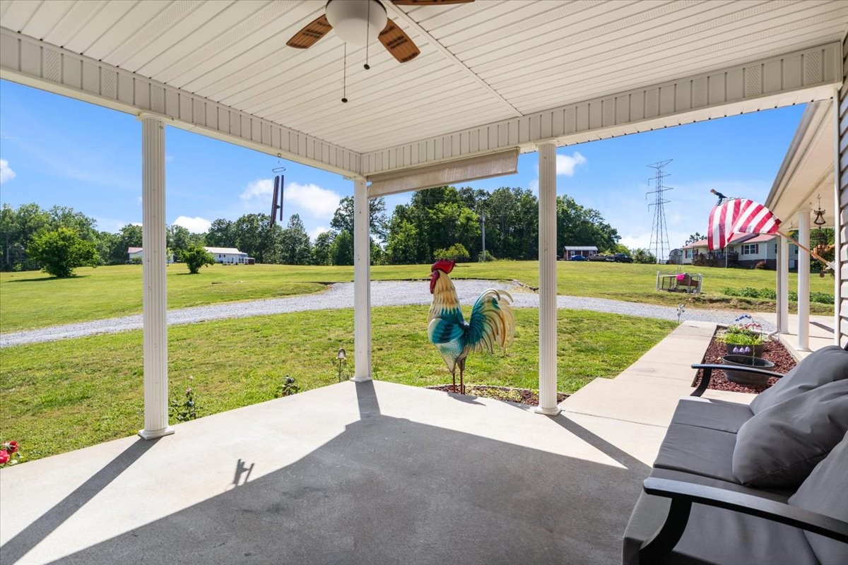 109 Bessie Clark Road Erin, TN 37061 - Photo 6 of 43 a view of swimming pool with a table and chairs under an umbrella