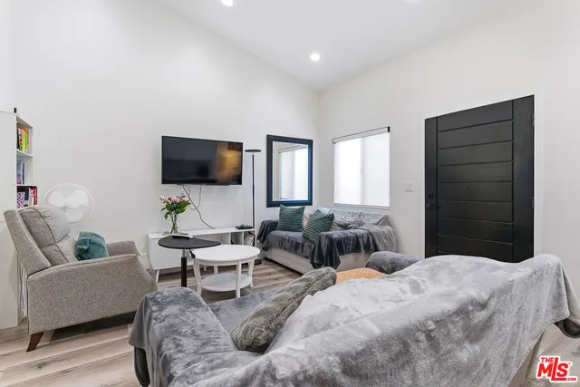 a bedroom with a bed and a couch