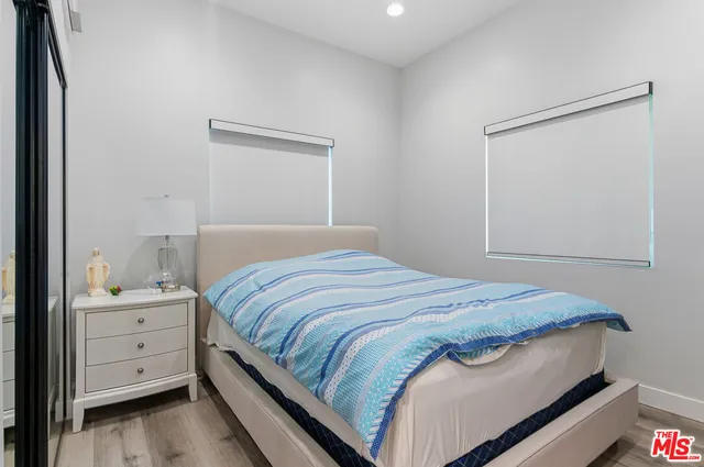 a bedroom with a bed and a closet