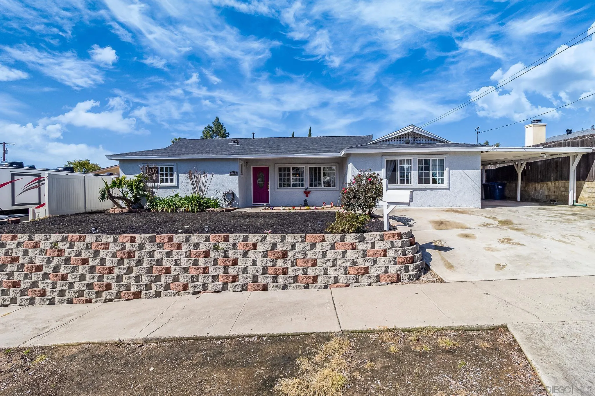 9780 Highdale Road Santee, CA 92071 - Photo 1 of 20 a front view of a house with a garden