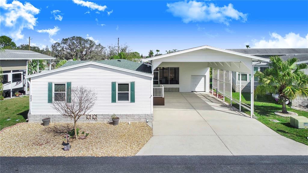 265 Fairway Boulevard Frostproof, FL 33843 - Photo 1 of 1 a view of a white house with a yard