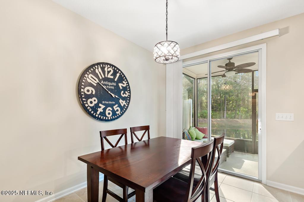 102 San Briso Way St. Augustine, FL 32092 - Photo 13 of 62 a view of a dining room with furniture window and wooden floor