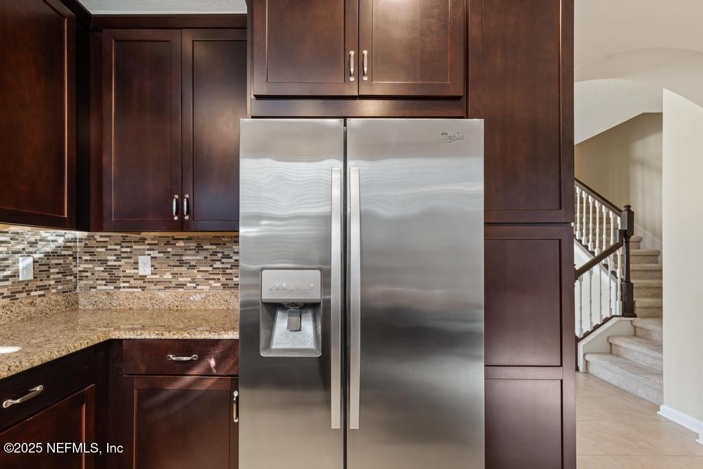 102 San Briso Way St. Augustine, FL 32092 - Photo 25 of 62 a kitchen with metallic refrigerator freezer and a dishwasher