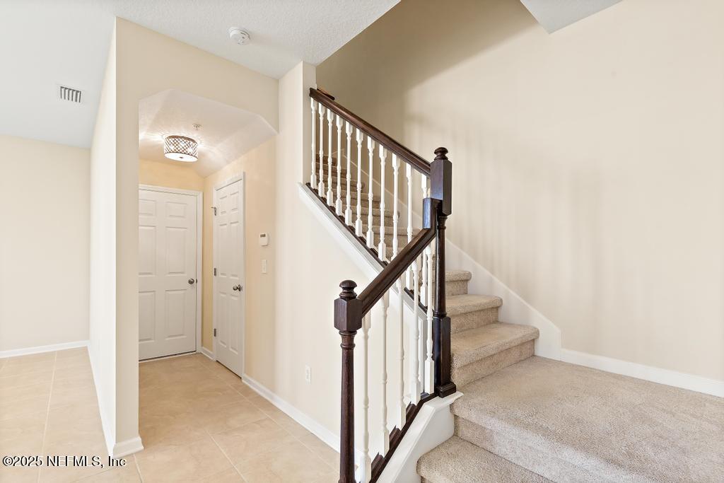 102 San Briso Way St. Augustine, FL 32092 - Photo 26 of 62 a view of a hallway with staircase