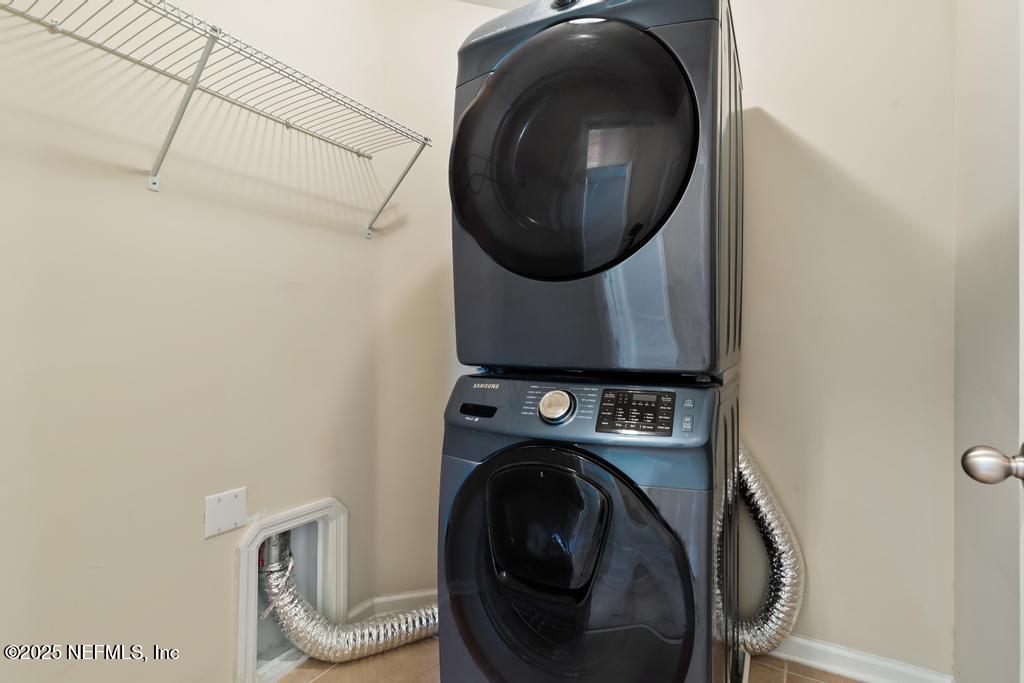 102 San Briso Way St. Augustine, FL 32092 - Photo 31 of 62 a utility room with dryer and washer
