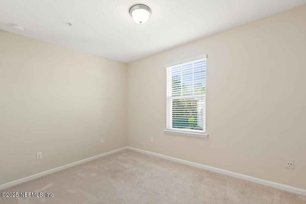 102 San Briso Way St. Augustine, FL 32092 - Photo 33 of 62 an empty room with a window