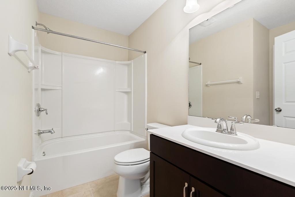 102 San Briso Way St. Augustine, FL 32092 - Photo 35 of 62 a bathroom with a sink a toilet and shower