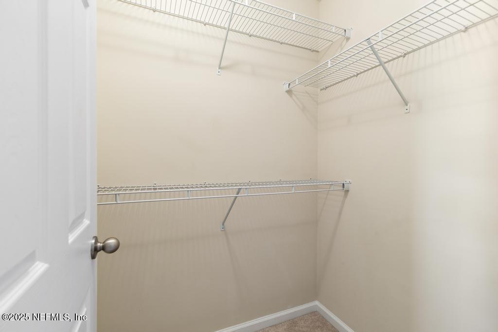 102 San Briso Way St. Augustine, FL 32092 - Photo 40 of 62 a view of a room with racks on the wall