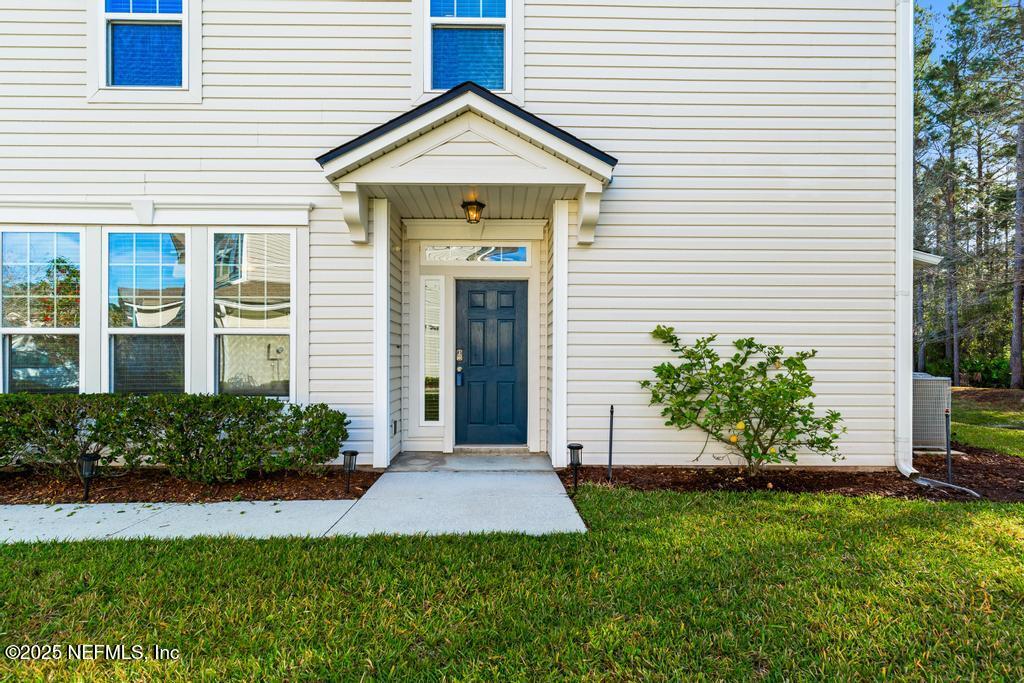 102 San Briso Way St. Augustine, FL 32092 - Photo 5 of 62 a front view of a house with a garden