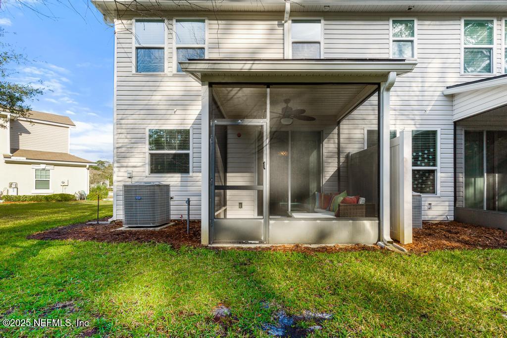 102 San Briso Way St. Augustine, FL 32092 - Photo 55 of 62 a view of a patio with table and chairs and potted plants