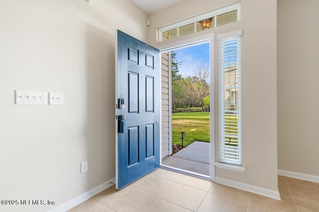 102 San Briso Way St. Augustine, FL 32092 - Photo 8 of 62 a view of entryway with a floor to ceiling window and stairs