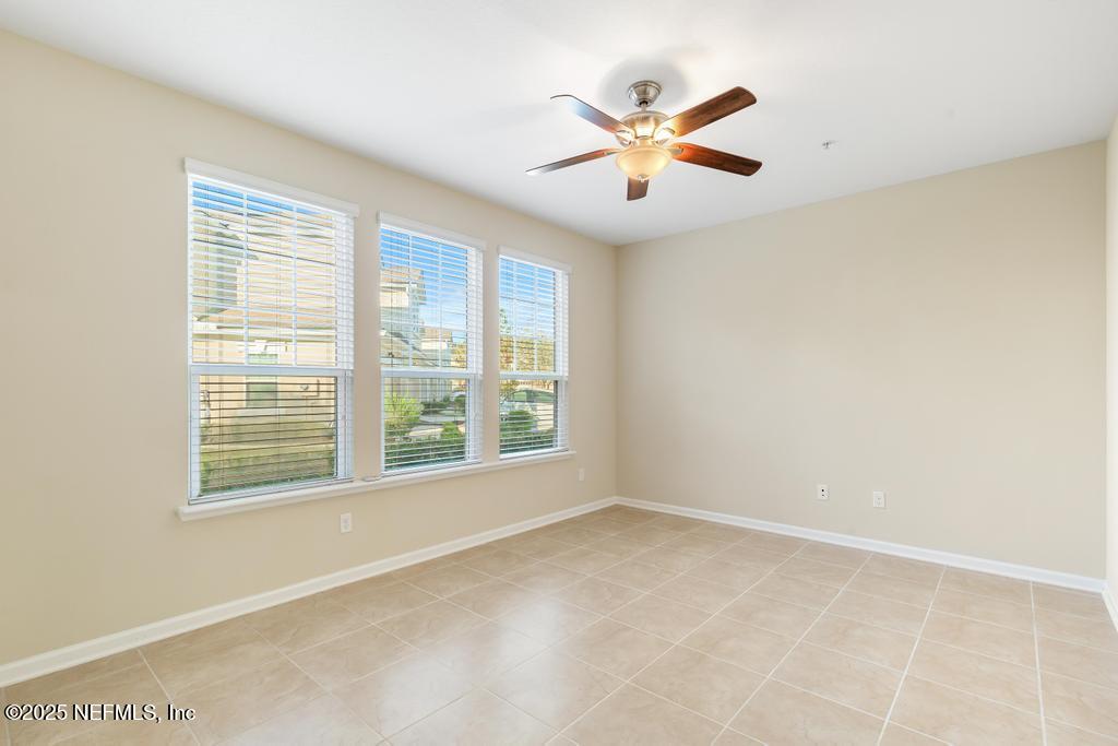 102 San Briso Way St. Augustine, FL 32092 - Photo 10 of 62 a view of an empty room with chandelier fan and fire place