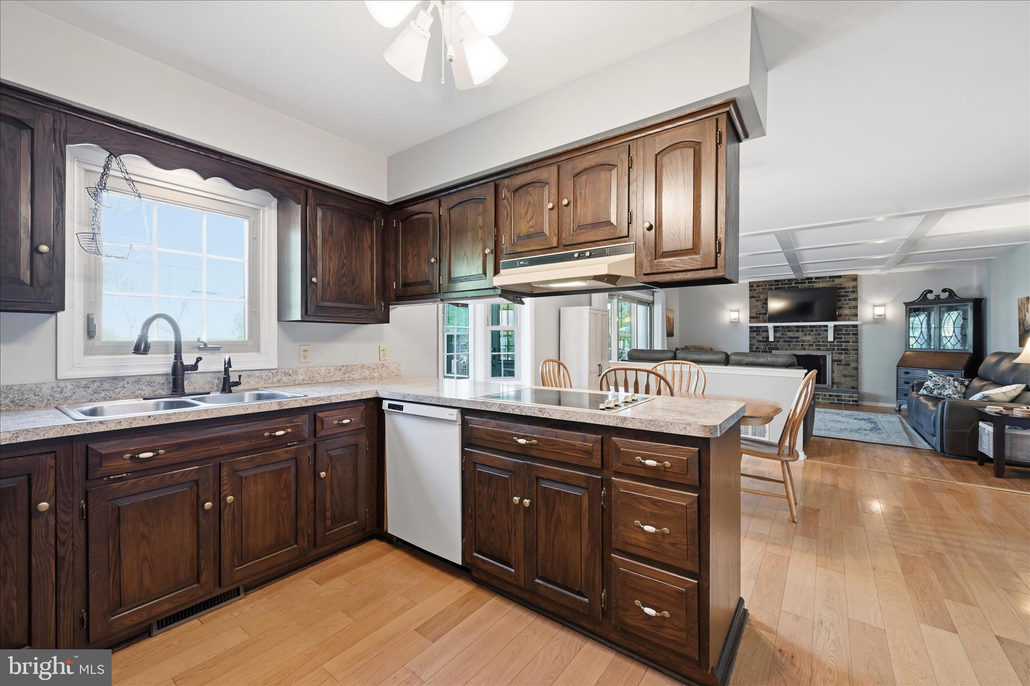 1828 North Eden Road Lancaster, PA 17601 - Photo 19 of 56 a kitchen with stainless steel appliances granite countertop a sink dishwasher stove and cabinets with wooden floor