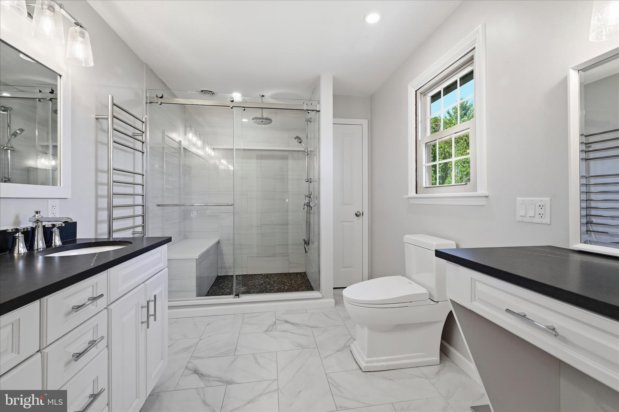 1828 North Eden Road Lancaster, PA 17601 - Photo 30 of 56 a bathroom with a granite countertop sink a toilet a mirror and shower