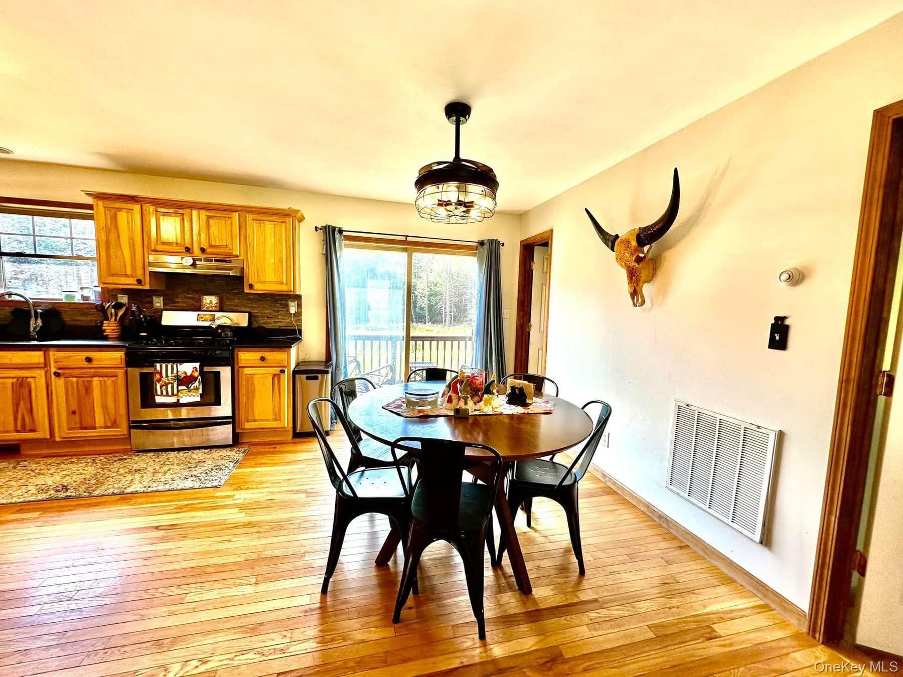 595 Hurd And Parks Road Swan Lake, NY 12783 - Photo 16 of 43 Dining room featuring light wood-style flooring