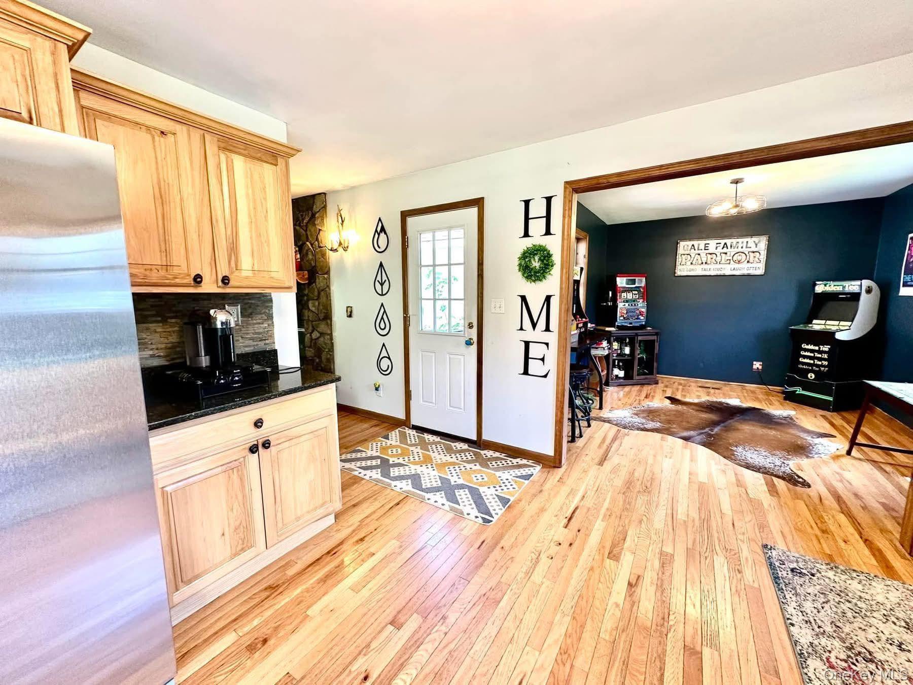 595 Hurd And Parks Road Swan Lake, NY 12783 - Photo 23 of 43 Kitchen featuring freestanding refrigerator, light wood-type flooring, and light brown cabinetry