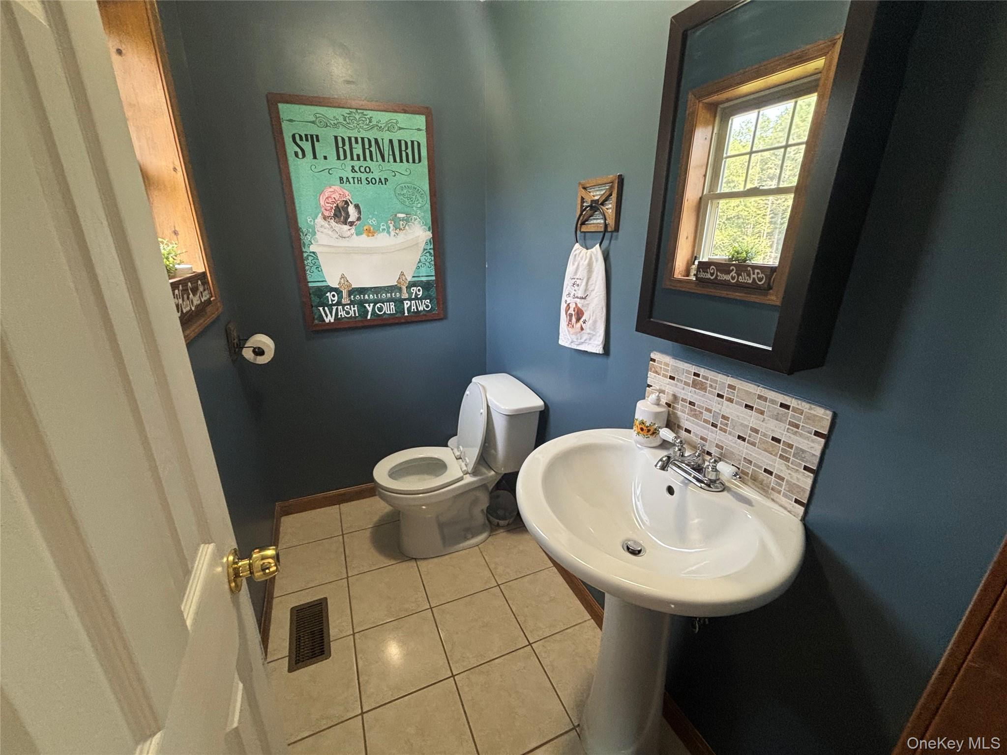 595 Hurd And Parks Road Swan Lake, NY 12783 - Photo 28 of 43 Bathroom featuring decorative backsplash and tile patterned floors