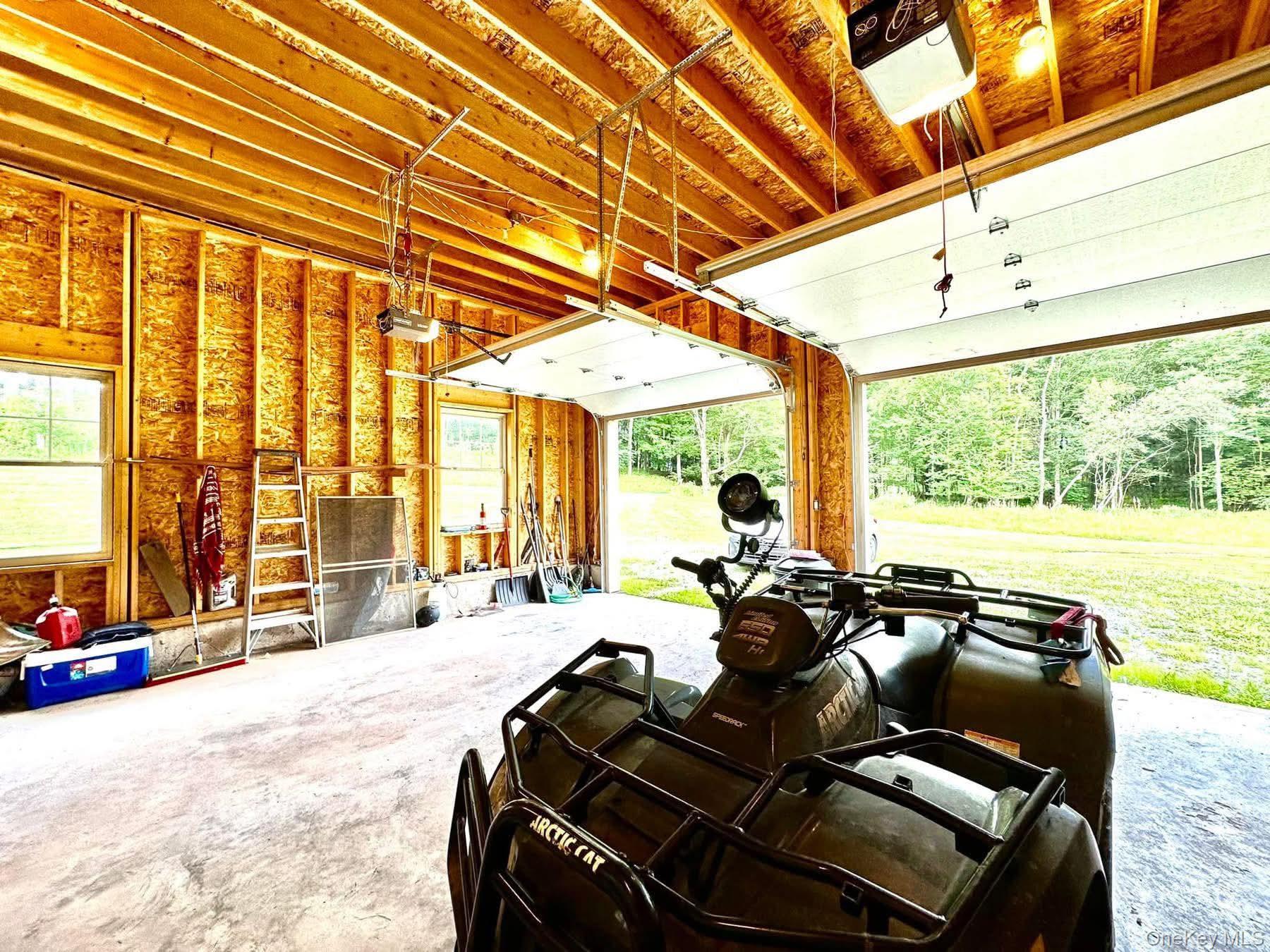 595 Hurd And Parks Road Swan Lake, NY 12783 - Photo 43 of 43 Garage featuring a garage door opener