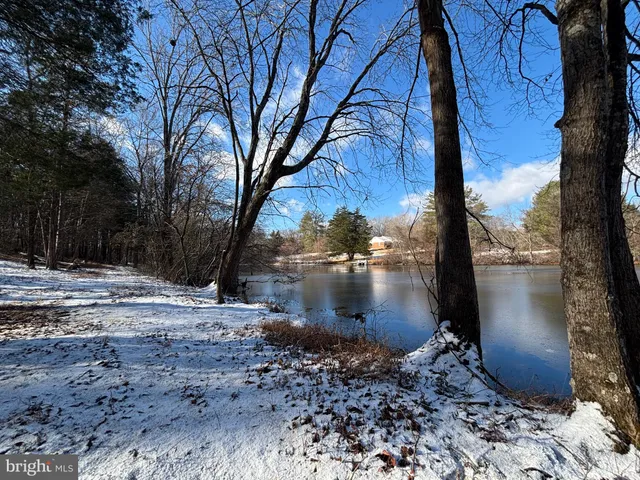 a view of water fountain with a yard