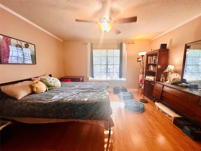 a view of a dining room with furniture and a large window