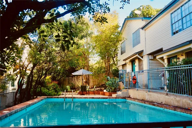 a backyard view with a seating space