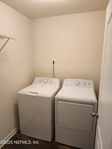 a utility room with dryer and washer