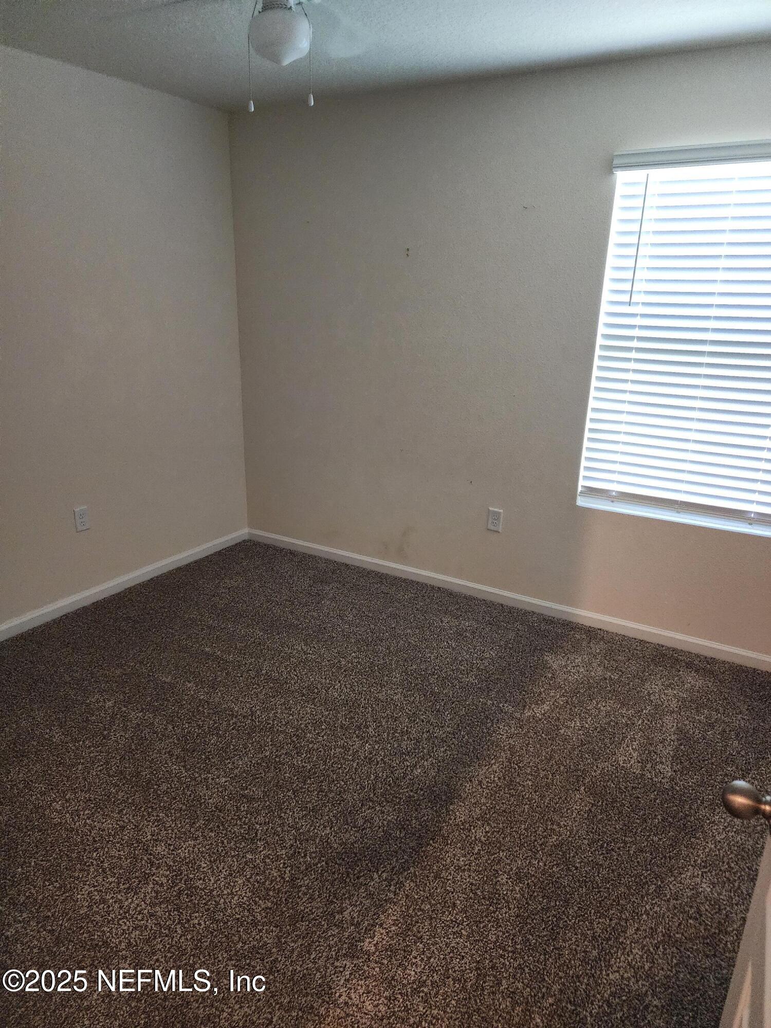 2295 Falling Star Ln Green Cove Springs Green Cove Springs, FL 32043 - Photo 13 of 24 an empty room with a window
