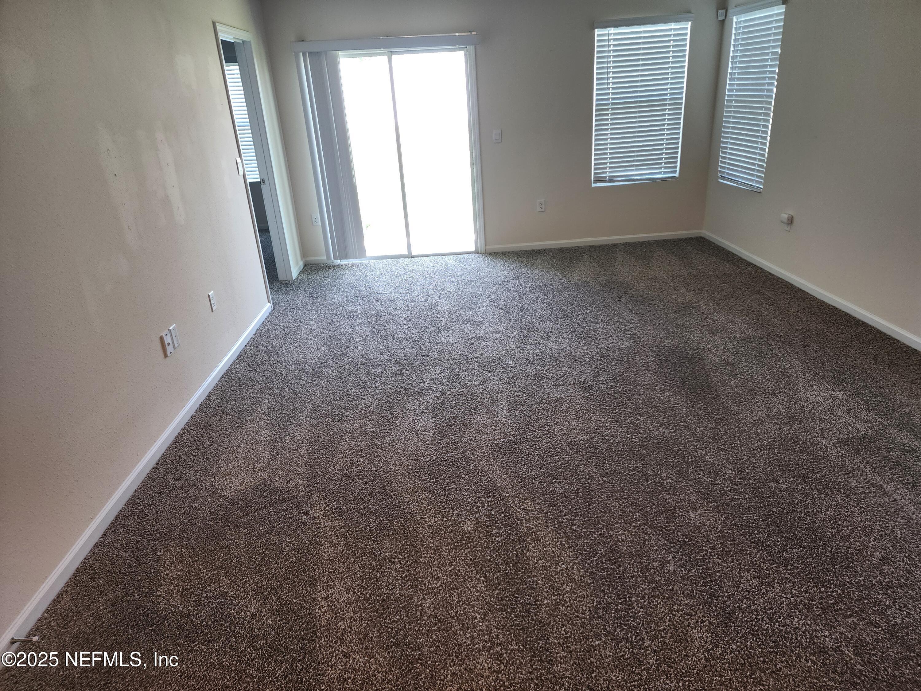2295 Falling Star Ln Green Cove Springs Green Cove Springs, FL 32043 - Photo 16 of 24 an empty room with windows
