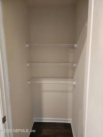 a view of small space with racks on the wall