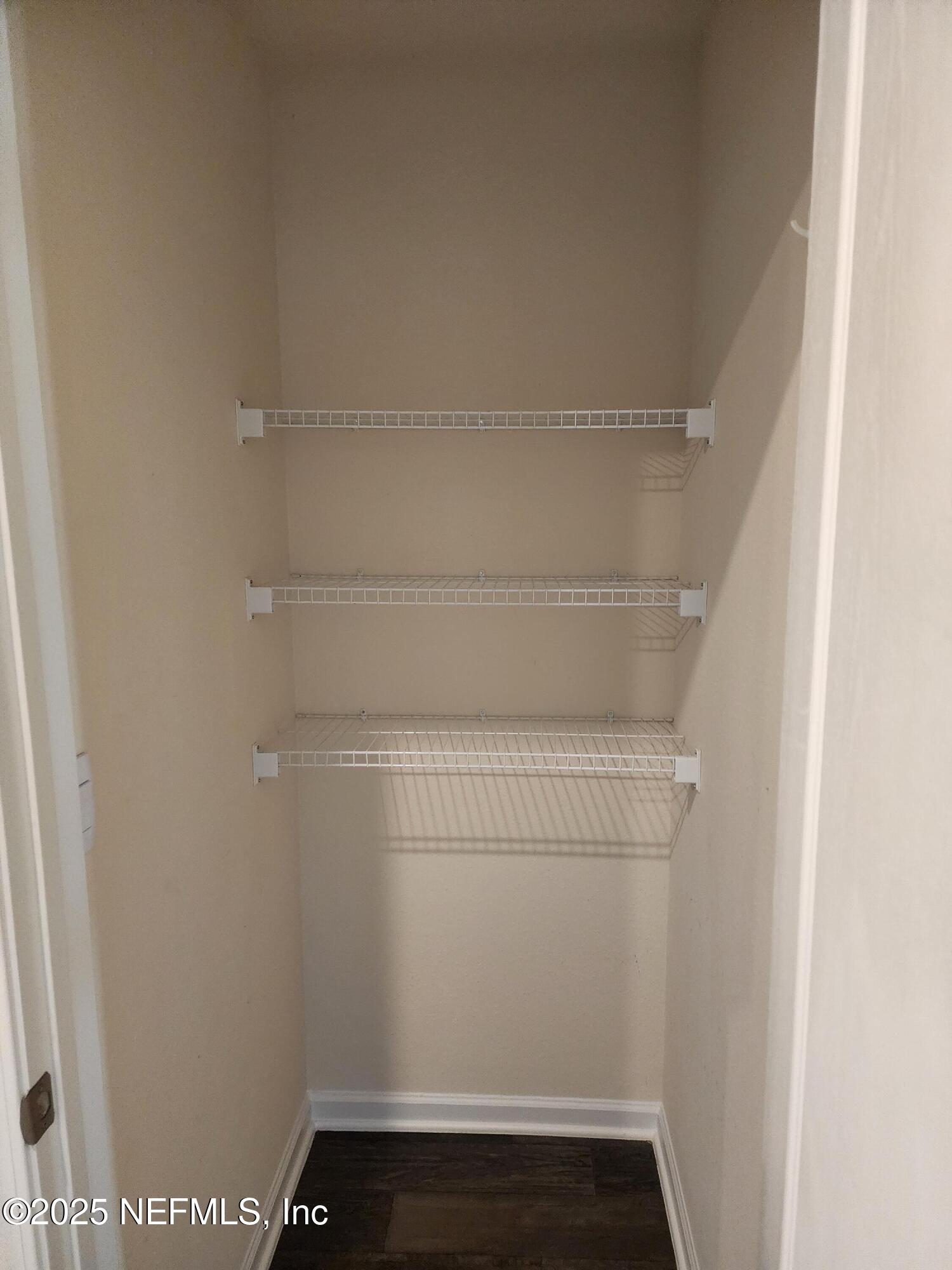 2295 Falling Star Ln Green Cove Springs Green Cove Springs, FL 32043 - Photo 17 of 24 a view of small space with racks on the wall