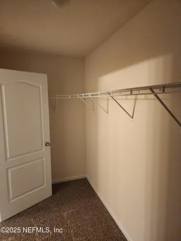 a view of an empty walk in closet