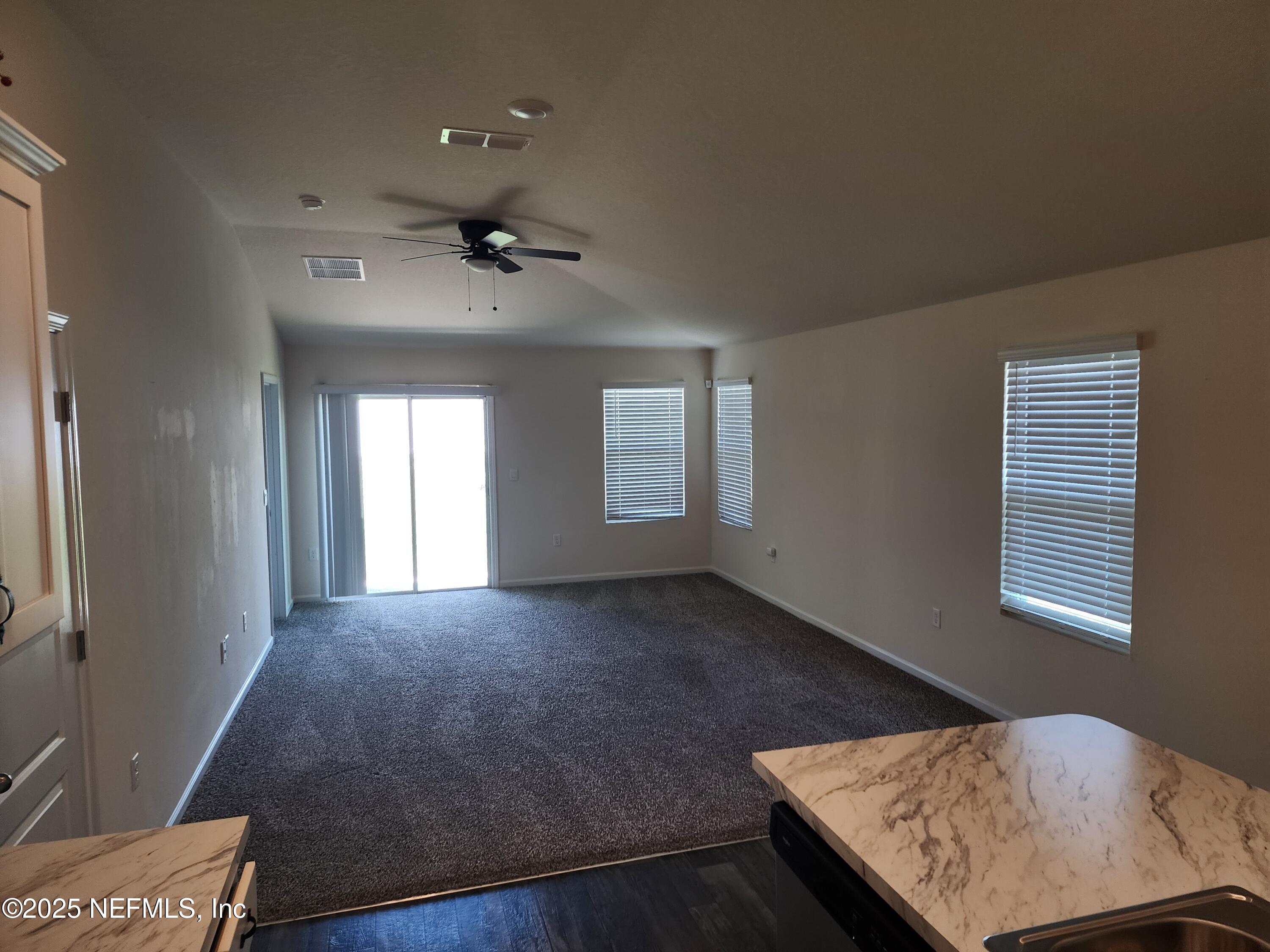 2295 Falling Star Ln Green Cove Springs Green Cove Springs, FL 32043 - Photo 9 of 24 a view of an empty room and window