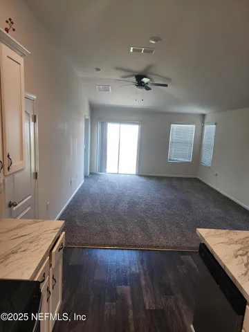 a view of a hallway with entryway