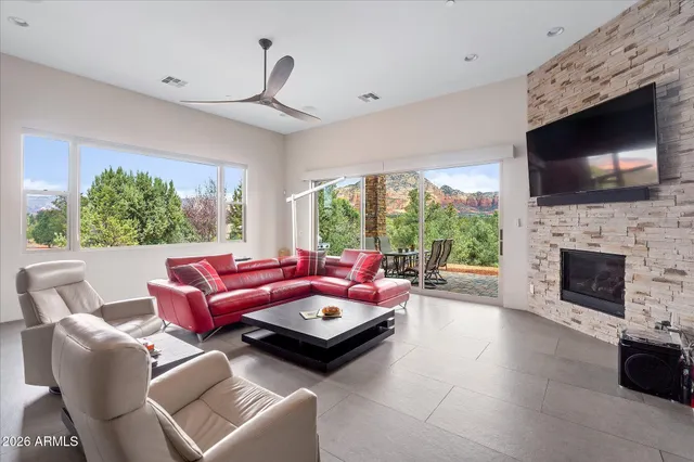 a living room with furniture fireplace and a flat screen tv