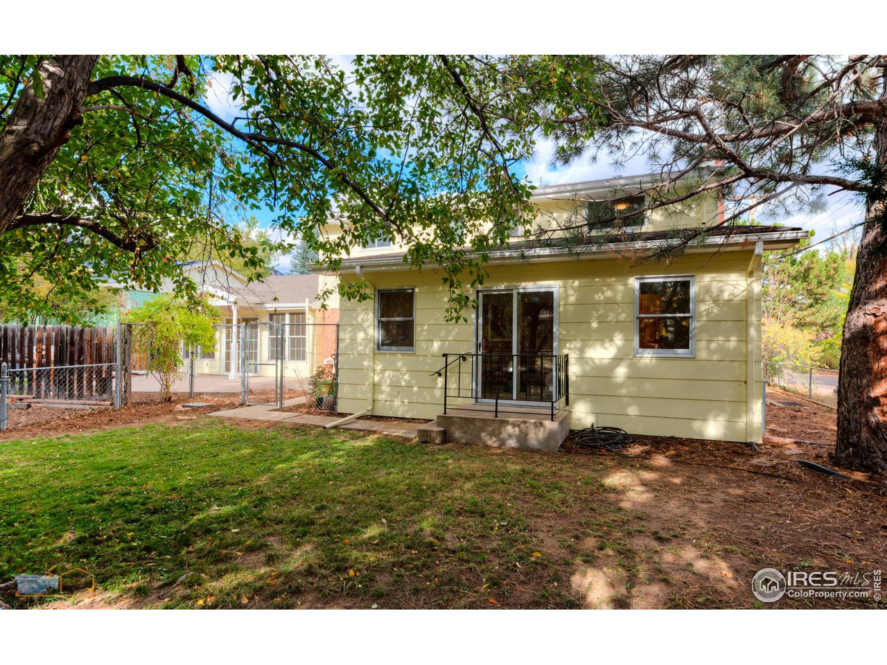 1050 Berea Drive Boulder, CO 80305 - Photo 12 of 40 a view of a house with a yard