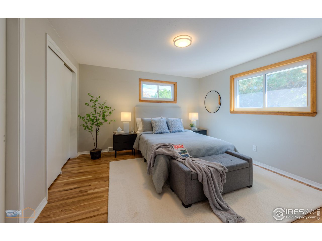1050 Berea Drive Boulder, CO 80305 - Photo 24 of 40 a bedroom with a bed and a painting on the wall