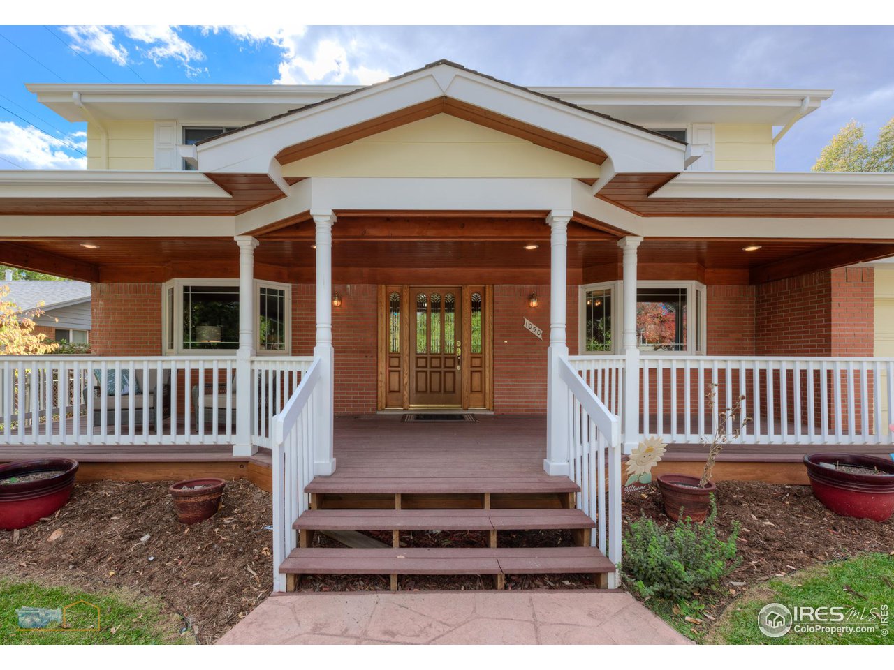 1050 Berea Drive Boulder, CO 80305 - Photo 3 of 40 front view of a house with a porch