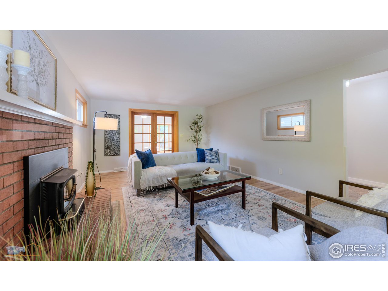 1050 Berea Drive Boulder, CO 80305 - Photo 6 of 40 a living room with furniture and a fireplace