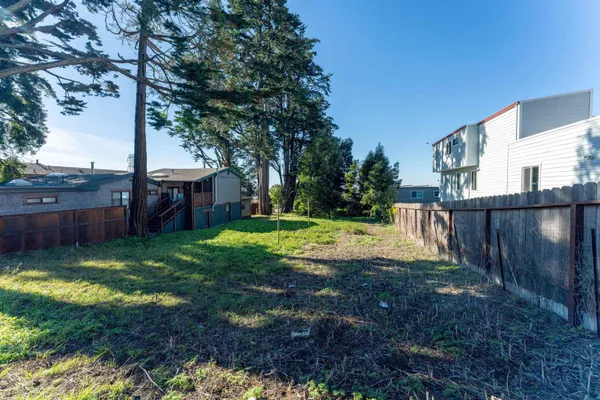 a view of a backyard with a garden