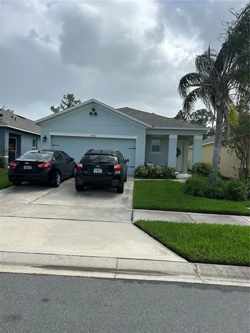 a view of a car parked in front of a house