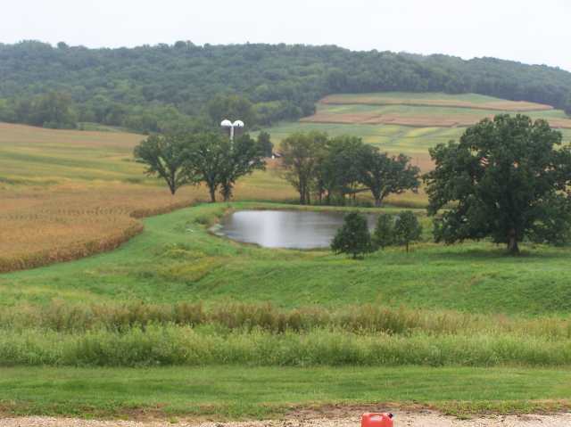 2287 West Hanover Road Hanover, IL 61041 - Photo 8 of 9 a view of a lake with a mountain