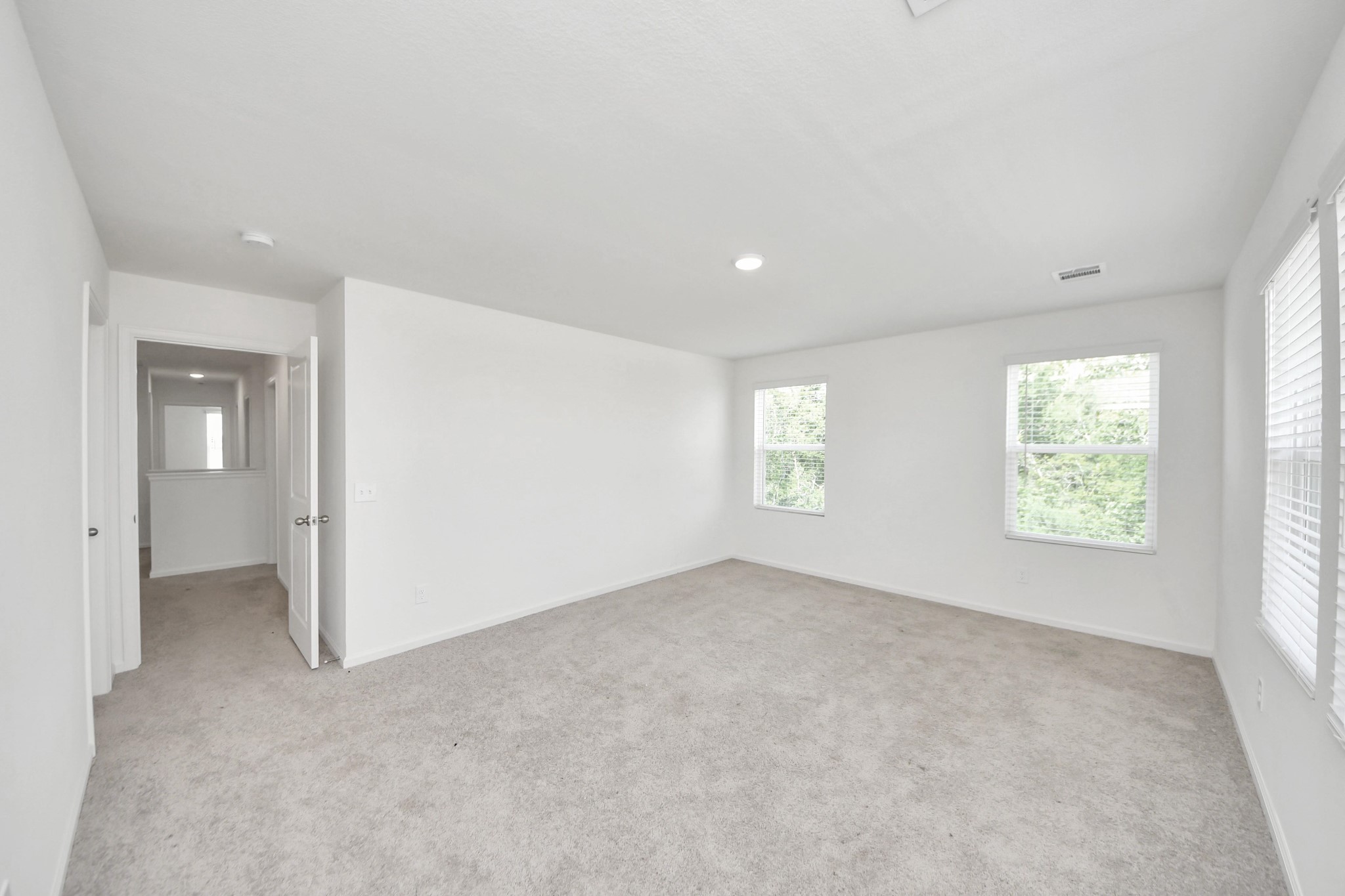 10303 Rose Mar Drive, Unit B Rosharon, TX 77583 - Photo 21 of 49 an empty room with windows