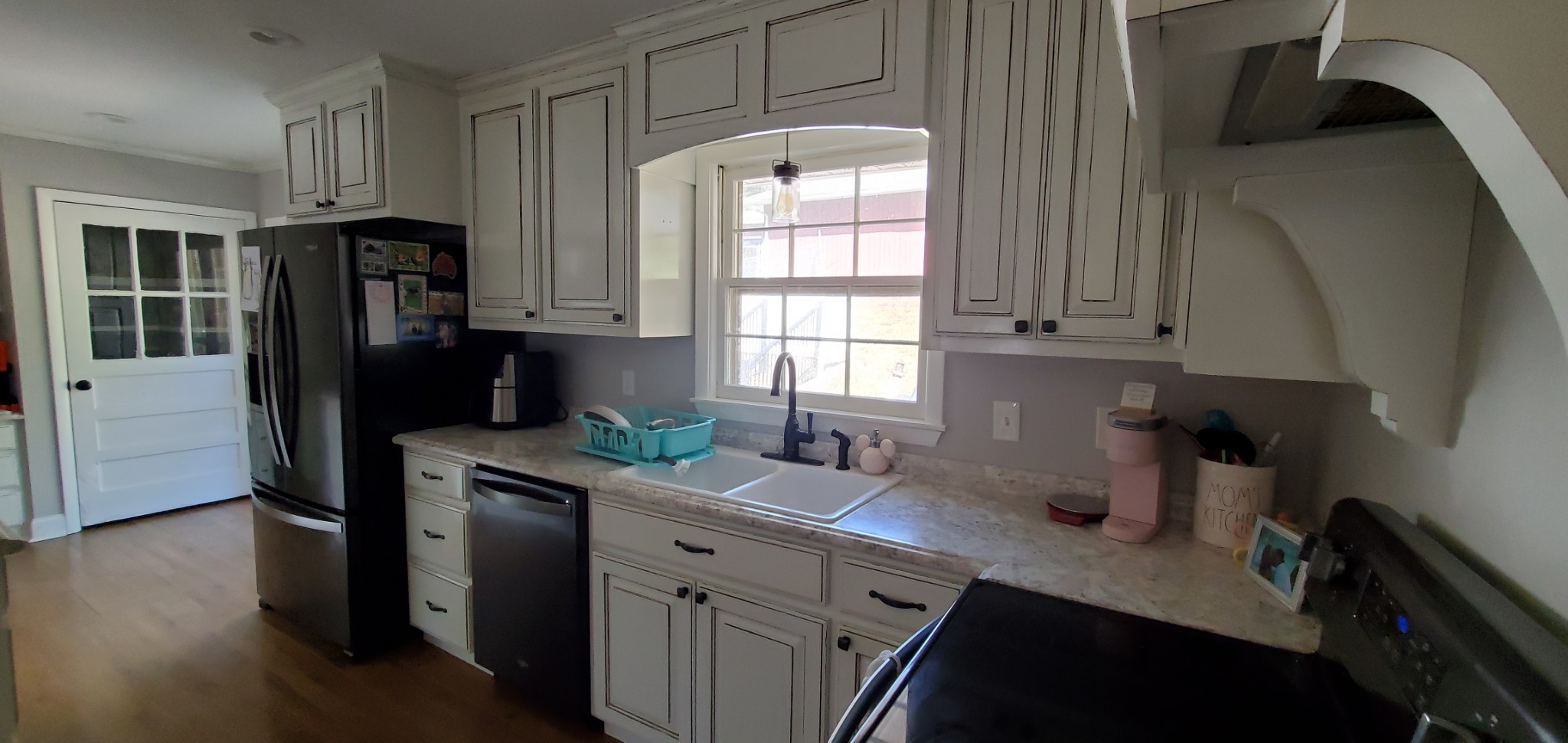 1915 Crescentview Road Pulaski, TN 38478 - Photo 12 of 28 a kitchen with a sink a refrigerator and window