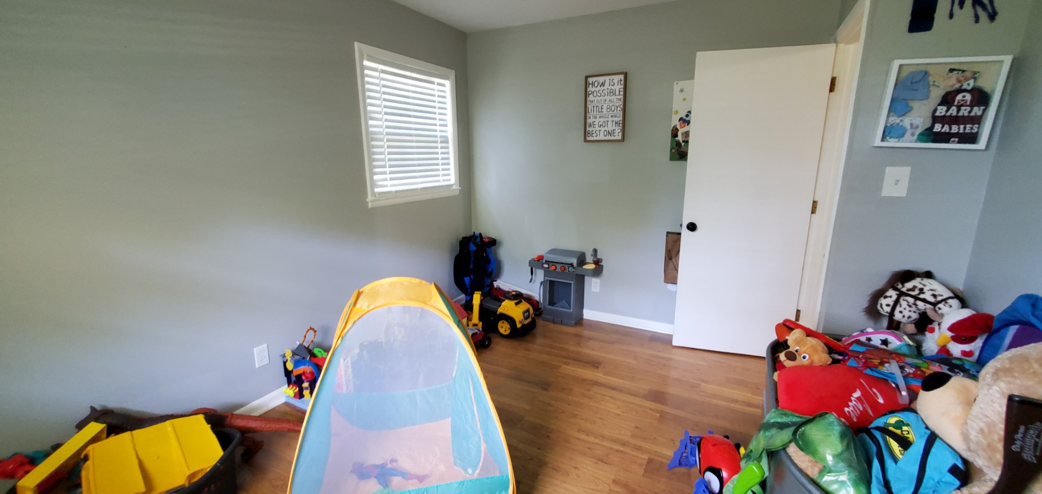 1915 Crescentview Road Pulaski, TN 38478 - Photo 21 of 28 a bedroom with a bed and a wooden floor